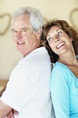 Buy stock photo Love, smile or old couple in lounge with support, healthy relationship or bonding on weekend break. Trust, portrait or elderly people in home with care, connection or romantic moment in retirement.