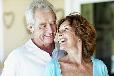 Buy stock photo Love, laughing and senior couple in home with support, happiness and care in retirement. Elderly man, woman and marriage for trust, funny together and bonding with spouse or partner in old age