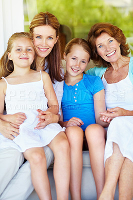 Buy stock photo Grandmother, mom and happy children with love on sofa, relax and bonding together on weekend break. Grandparent, sisters and mother at home, kids and generations with family portrait in living room