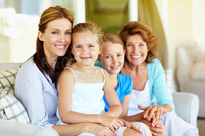 Buy stock photo Grandmother, mom and happy kids with love on sofa, relax and bonding together on weekend break. Grandparent, sisters and mother at home, children and generations with family portrait in living room