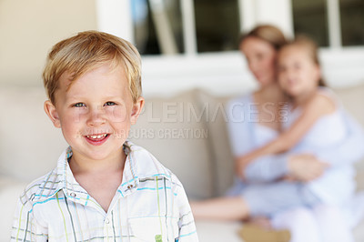 Buy stock photo Happy, calm and portrait of kid in home with childhood development, growth or bonding with family. Smile, relax and boy on sofa in living room with positive attitude, safety and trust in house.