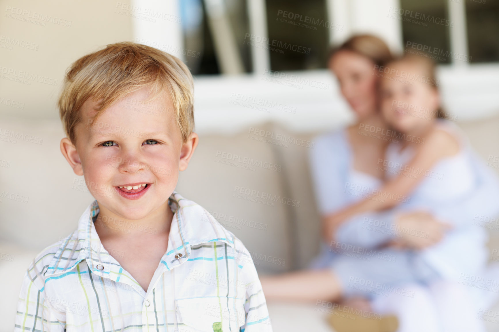 Buy stock photo Happy, calm and portrait of kid in home with childhood development, growth or bonding with family. Smile, relax and boy on sofa in living room with positive attitude, safety and trust in house.