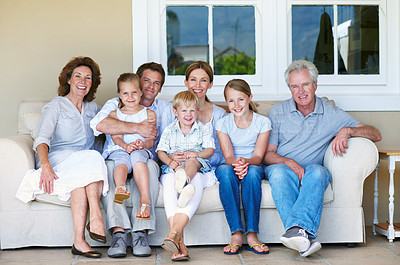 Buy stock photo Big family, portrait and children on couch, home and bonding with senior parents on weekend or love. Grandparents, together and connection with kids on break, men and women with smile in Germany