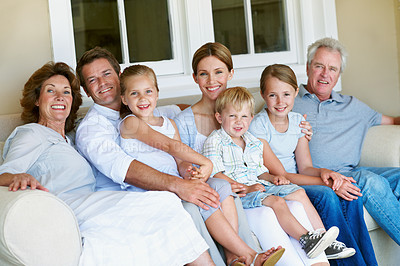 Buy stock photo Portrait, generations and children on sofa, home and bonding with senior parents on weekend or love. Big family, connection and happy people with kids on break, men and women with smile in Germany