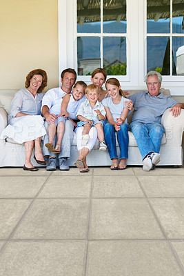 Buy stock photo Big family, portrait and kids on couch, home and bonding with senior parents on weekend or together. Happy people, generations and connection with children on break, men and women with smile at house
