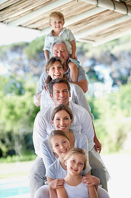 Buy stock photo Generations, portrait and row of family in backyard for bonding, relationship and connection. Happy, house and parents with senior mom, dad and children for love, support and together on weekend