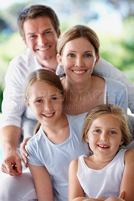 Buy stock photo Happy, portrait and parents with girls in home for bonding together, healthy relationship or care. Smile, family and children with love for connection, security and weekend break with support