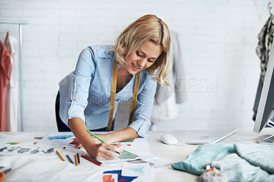 Buy stock photo A young designer working on some designs