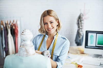 Buy stock photo A gorgeous young dressmaker working on her design on a mannequin