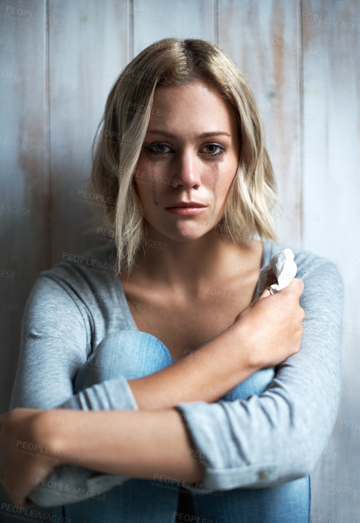 Buy stock photo Wooden wall, portrait and woman with tears, sad and crying with anxiety and frustrated after mistake. Mental health, guilt and person with depression, grief and mourning with broken heart or regret