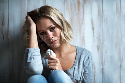 Buy stock photo Portrait of a pretty young blonde woman with mascara running down her face after crying