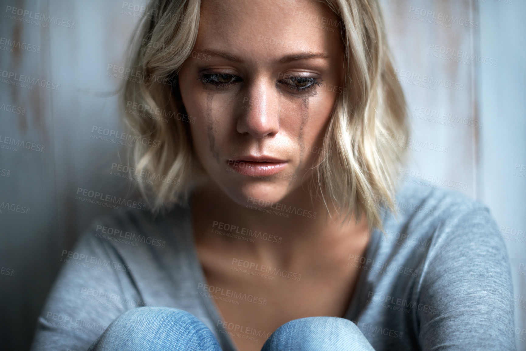 Buy stock photo Home, lonely and woman with tears, crying and unhappy with anxiety and sad with bad memories. Mental health, thinking and person with depression, grief and mourning with broken heart or regret