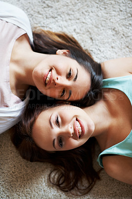 Buy stock photo Portrait of two teenage girls chilling on the floor at home