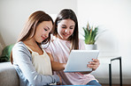 Doing homework on their tablet