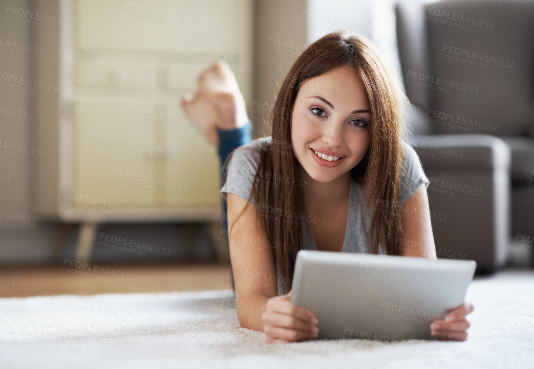 Buy stock photo Portrait, teenager and relax in home with tablet, smile and internet connectivity on weekend break. Happy, girl and rest on floor with digital technology, browse online and social media notification.