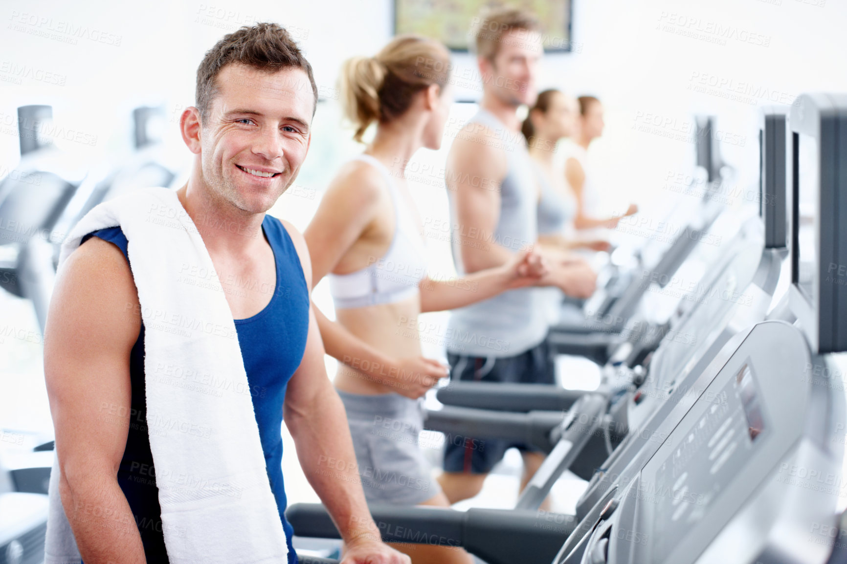 Buy stock photo Workout, health and happy man on treadmill at gym for wellness benefits, portrait or endurance exercise. Fitness club, cardio machine and person with towel, smile and training to burn calories