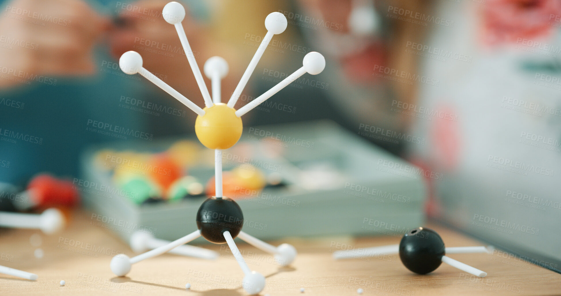 Buy stock photo Project, science and person with atom model on desk for studying, education or assignment in house. Learning, homework and toy structure of molecule, particle or element with physics assessment.