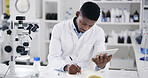 Tablet, black man and scientist in laboratory with notebook for medical research with notes. Digital technology, journal and African male biologist with online report on pharmaceutical study.
