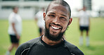Smile, rugby and man at field for game training, sports and confidence at competition practice. Portrait, proud player and happy person at pitch, professional athlete and exercise outdoor for match