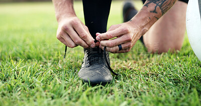 Buy stock photo Man, hands and shoelace on sports field for match start, preparation and safety for football practice. Athlete, person and secure soccer boots outdoor for fitness, beginning workout and exercise.