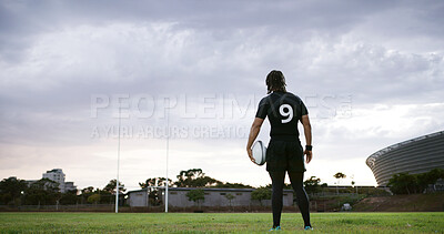 Buy stock photo Rugby, thinking or man on field with ball, goal mindset or daydreaming in fitness hobby. Reflection, back or player outdoor with space, athlete insight or performance perspective in collision sport.