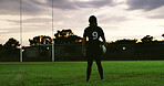 Rugby, thinking or player on field with ball, goal mindset or daydreaming in fitness hobby. Reflection, back or person with space, athlete insight or performance perspective in collision sport.