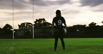 Buy stock photo Rugby, thinking or player on field with ball, goal mindset or daydreaming in fitness hobby. Reflection, back or person with space, athlete insight or performance perspective in collision sport.