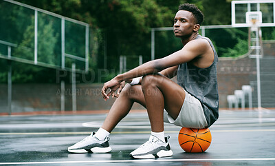 Buy stock photo Thinking, break or black man on basketball court with ball, fitness fatigue or goal mindset in weekend match. Rest, daydream or player with reflection, hoop sport and recovery in training session.