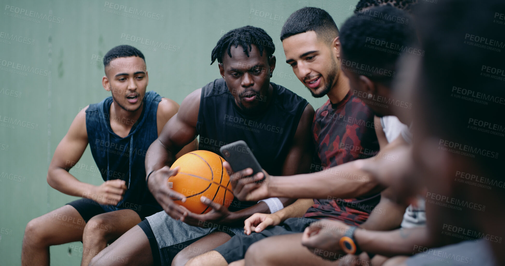Buy stock photo Basketball, team and talk outdoor with phone, social media video and surprise for skill development. Men, discussion or shock with tech for sports news, practice break or notification for fitness app