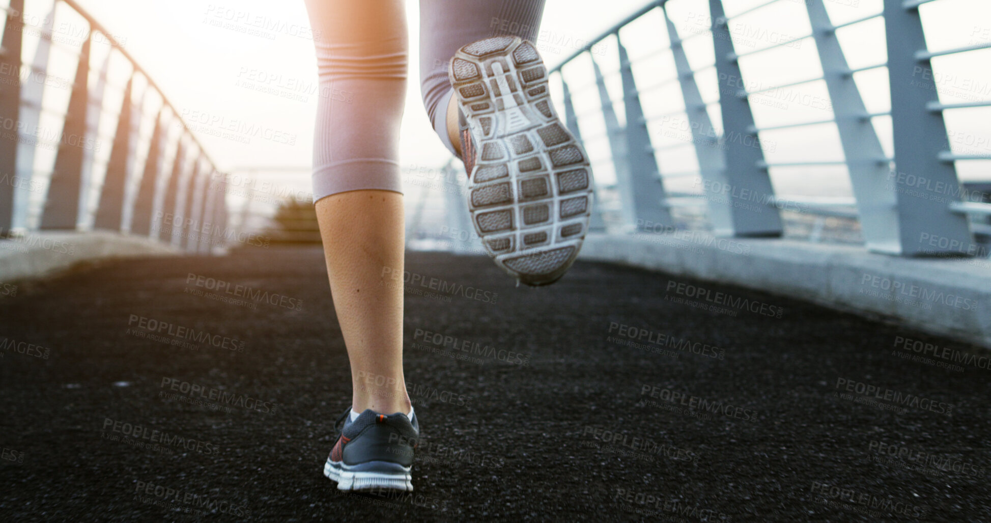 Buy stock photo Fitness, person and running with legs on city bridge for outdoor workout, exercise or challenge. Active, sneakers and runner with sport shoes or sprint for cardio training, health or wellness in town