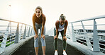Bridge, fitness and running with tired women in city together for cardio, training or workout. Break, breathing and recovery with exhausted friends in urban town for fatigue, health or wellness