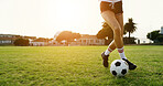 Woman, legs and training on field with soccer ball, practice skills and fitness for sports performance. Space, person and shoes outdoor on grass with exercise, wellness or technique for football game