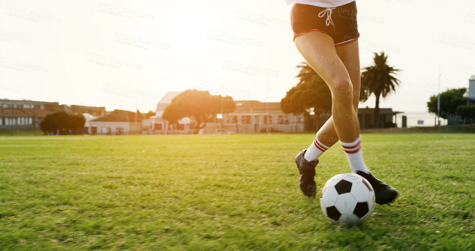 Buy stock photo Woman, legs and training on field with soccer ball, practice skills and fitness for sports performance. Space, person and shoes outdoor on grass with exercise, wellness or technique for football game