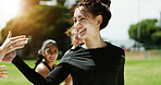 High five, smile and woman with practice on soccer field, training support and celebration for goal. Football competition, winner and player with match point for victory, outdoor and congratulations
