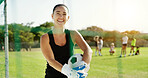 Soccer, portrait and goalkeeper with happy woman on grass field for sports game or outdoor match. Active, female person or goalie with smile, net or ball for football practice or training on pitch