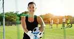 Soccer, portrait and goalkeeper with happy woman for sports game or outdoor match on grass field. Active, female person or goalie with smile, net or ball for football practice or training on pitch