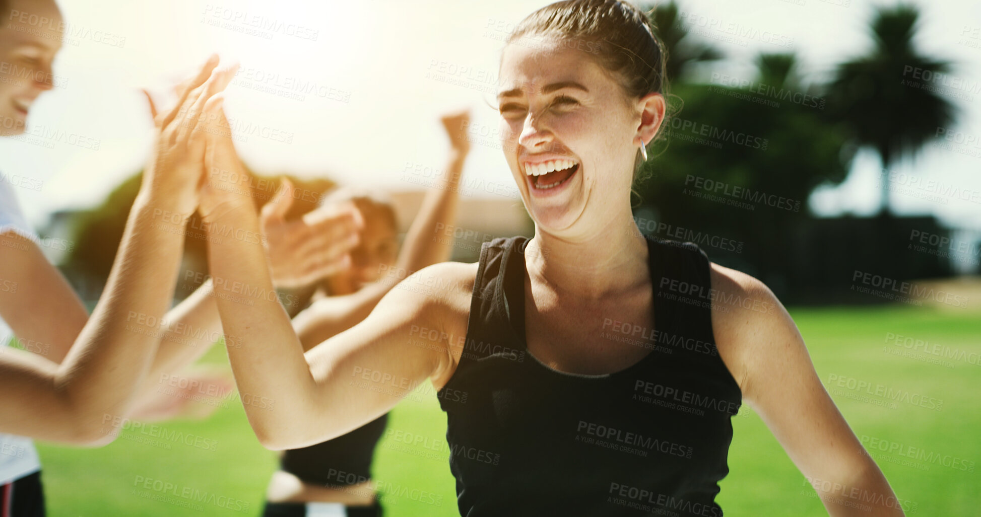 Buy stock photo Soccer, team and happy woman with high five on grass field for winning, goal or outdoor match. Excited, female person or football player with smile or success for score or point on sports pitch