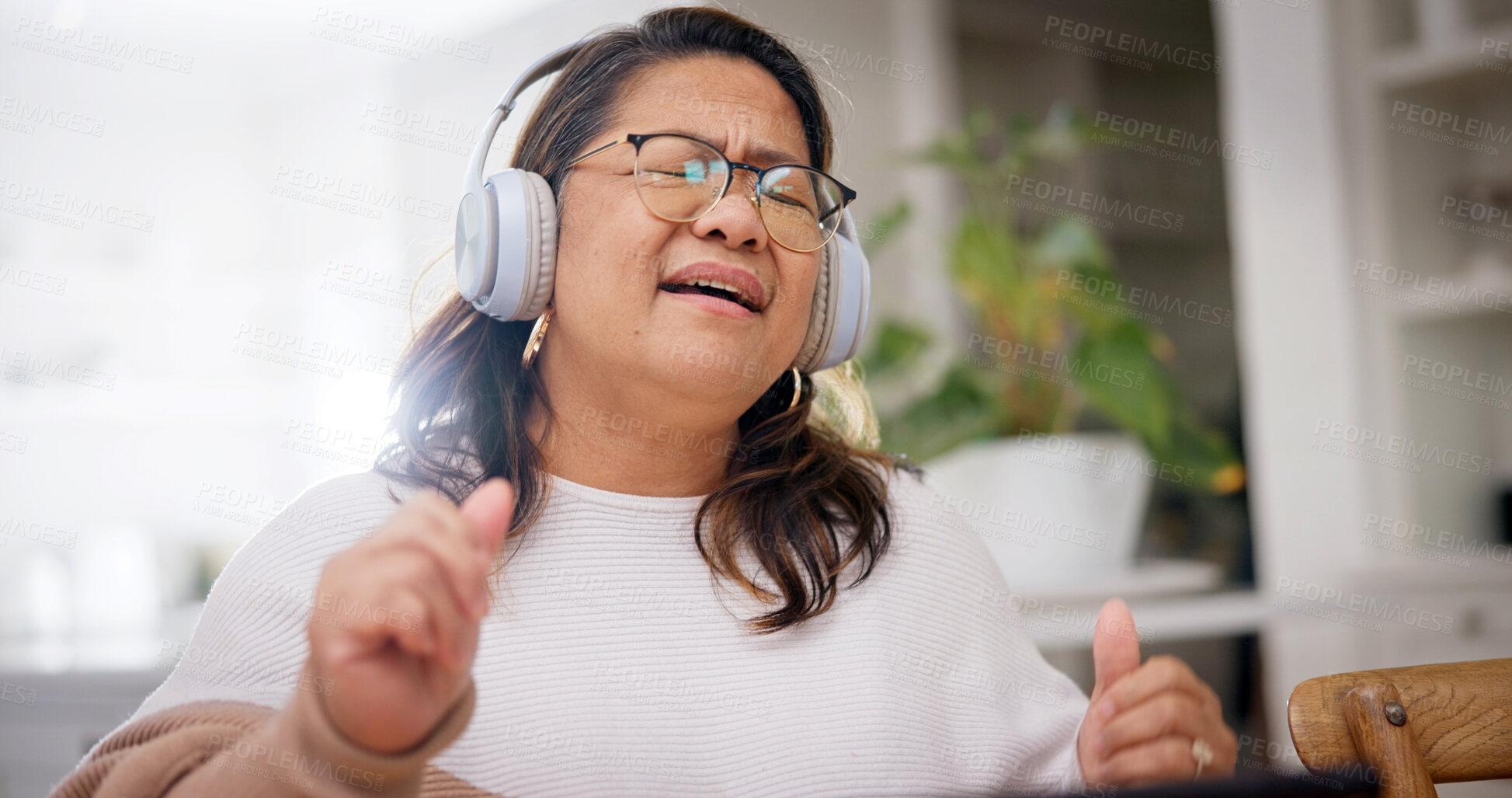 Buy stock photo Senior woman, home and singing with headphones, online or listen to music with subscription on break. Streaming, audio and mature person with technology, dance and rhythm with song playlist in house