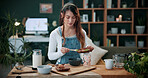 Woman, herbalist and home with plants for drink, healthy diet or natural medical remedy. Female person, herbologist or detox with green ingredients for brewing beverage, cure or experiment in house
