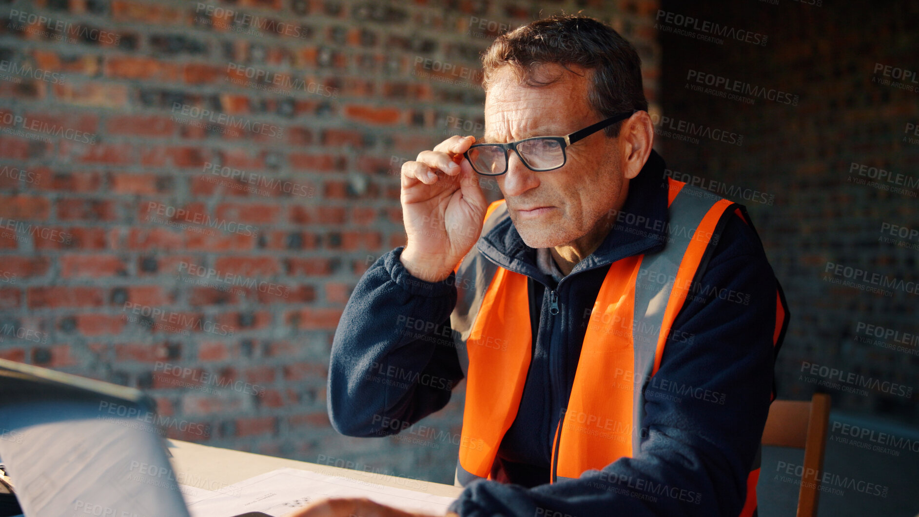 Buy stock photo Architect, online and man with laptop in construction site, research and property development on web. Civil engineer, reading and mature person with tech for architecture project or quality assurance