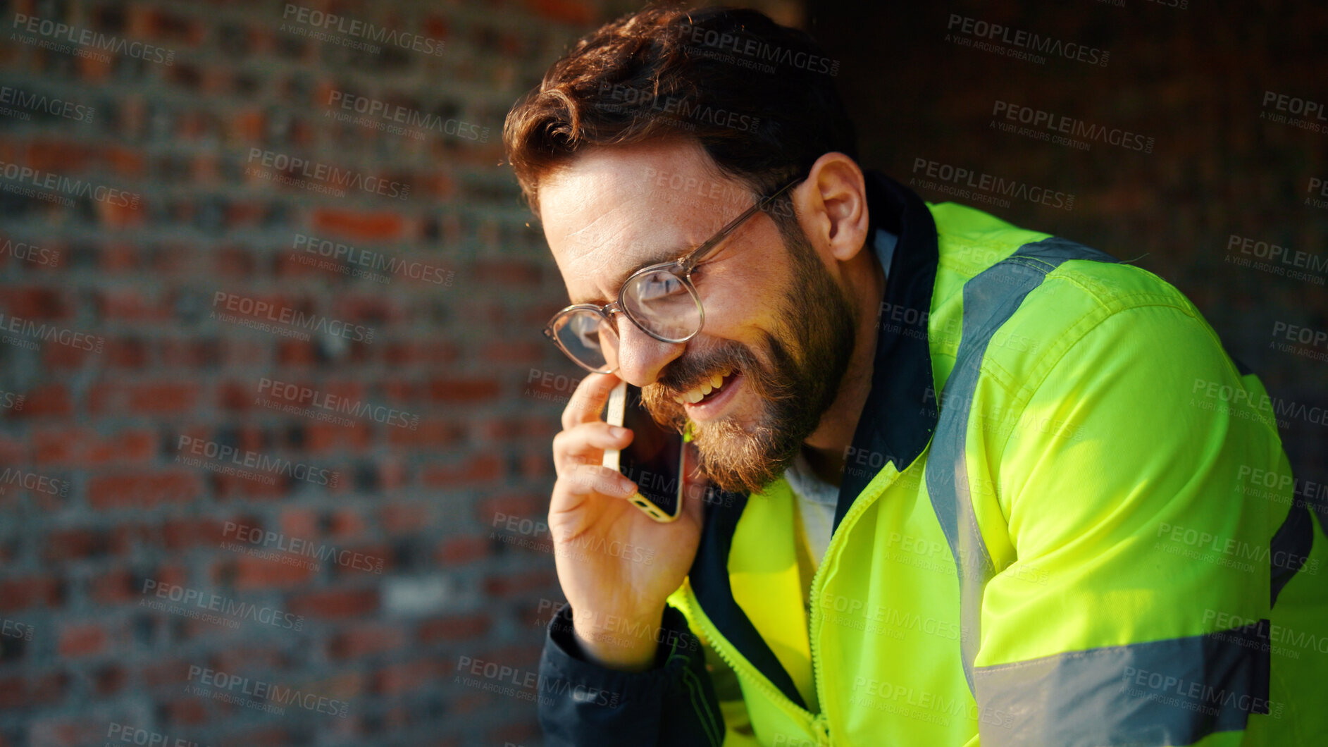Buy stock photo Architect, phone call and happy man with smile at construction site, safety and updates for contact. Civil engineer, laugh and person with mobile for discussion, quality assurance and architecture