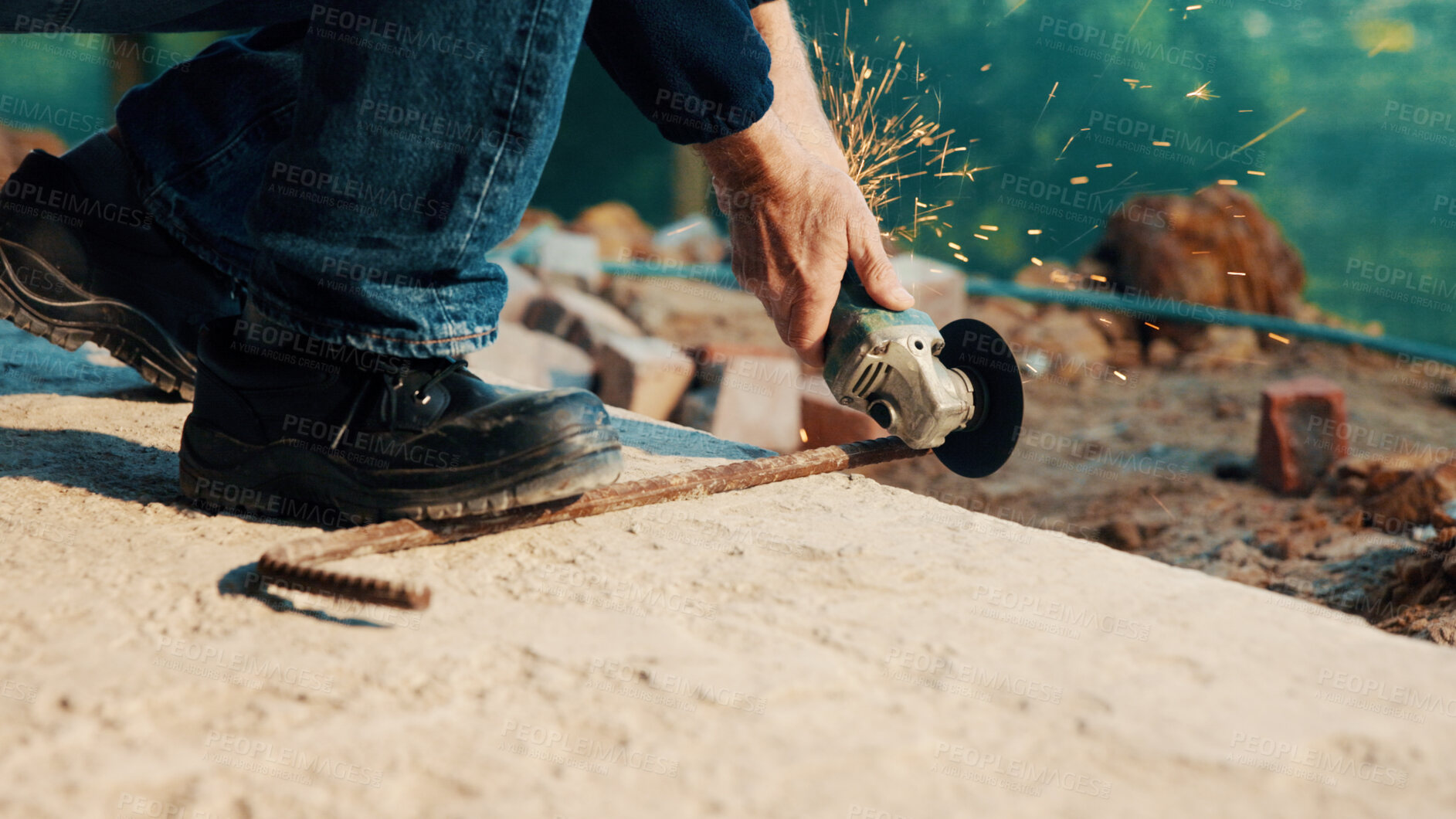 Buy stock photo Hands, engineer and grinder with metal at construction site for welding, cutting rod and manual labor. Person, electric tool and sparks for steel fabrication, surface smoothing and building industry