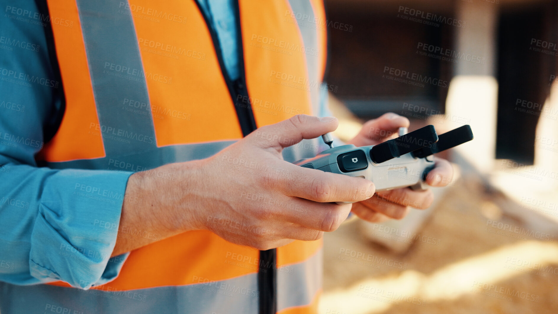 Buy stock photo Construction, hands and man with drone controller for surveying, inspection and area mapping. Surveyor, worker and UAV tech outdoor for site grading, monitor project development and building progress