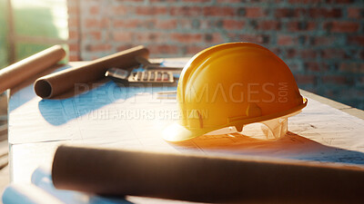 Buy stock photo Architecture, helmet and blueprint on desk, construction site and equipment for property development. Creative, floor plan and documents for building design, maintenance and info for home renovation