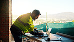 Architect, man or typing on laptop at construction site for digital design, report draft or planning. Architecture, person and tech on blueprint outdoor for building code, project progress and zoning