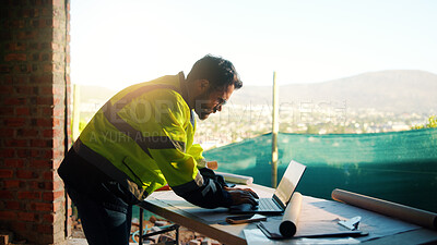 Buy stock photo Architect, man or typing on laptop at construction site for digital design, report draft or planning. Architecture, person and tech on blueprint outdoor for building code, project progress and zoning