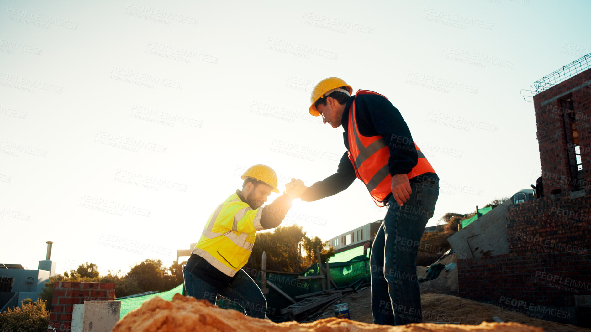 Buy stock photo People, engineer and help outdoor for construction, building development and infrastructure. Space, men and holding hands for civil engineering, safety inspection and project for property maintenance