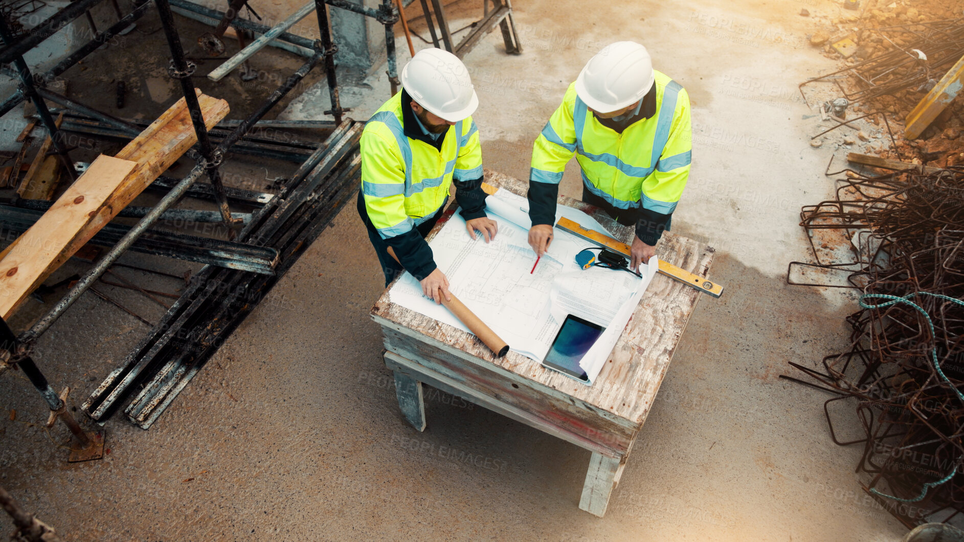 Buy stock photo Architect, team and talk with blueprint on site for design vision, building layout and compliance. Construction, architecture meeting and men with floor plan for structural review, progress and above