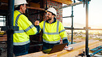Men, contractor or laptop with handshake on scaffolding for construction deal or agreement together. Happy, male people or civil engineer shaking hands with smile for building partnership on site
