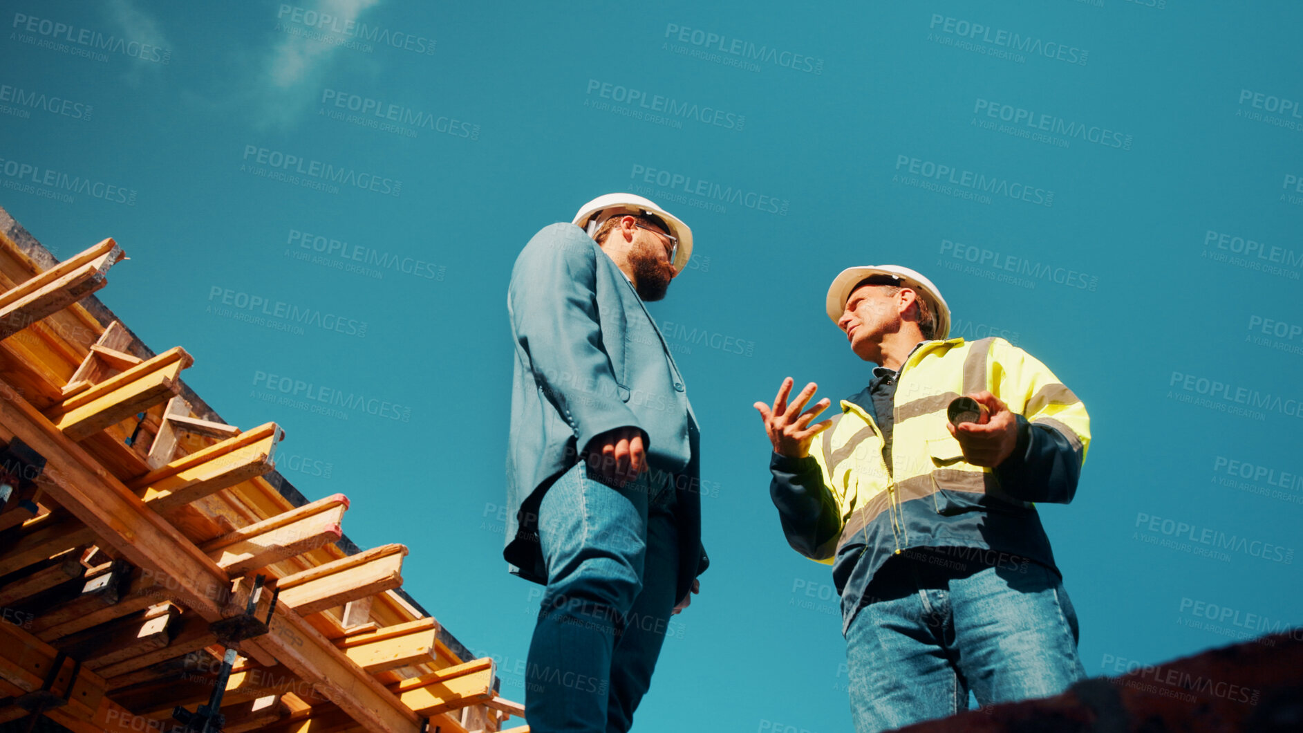 Buy stock photo Construction, architect or talk to manager on roof for site inspection, building update or teamwork. Low angle, men and project foreman with blueprint for renovation progress, architecture and safety